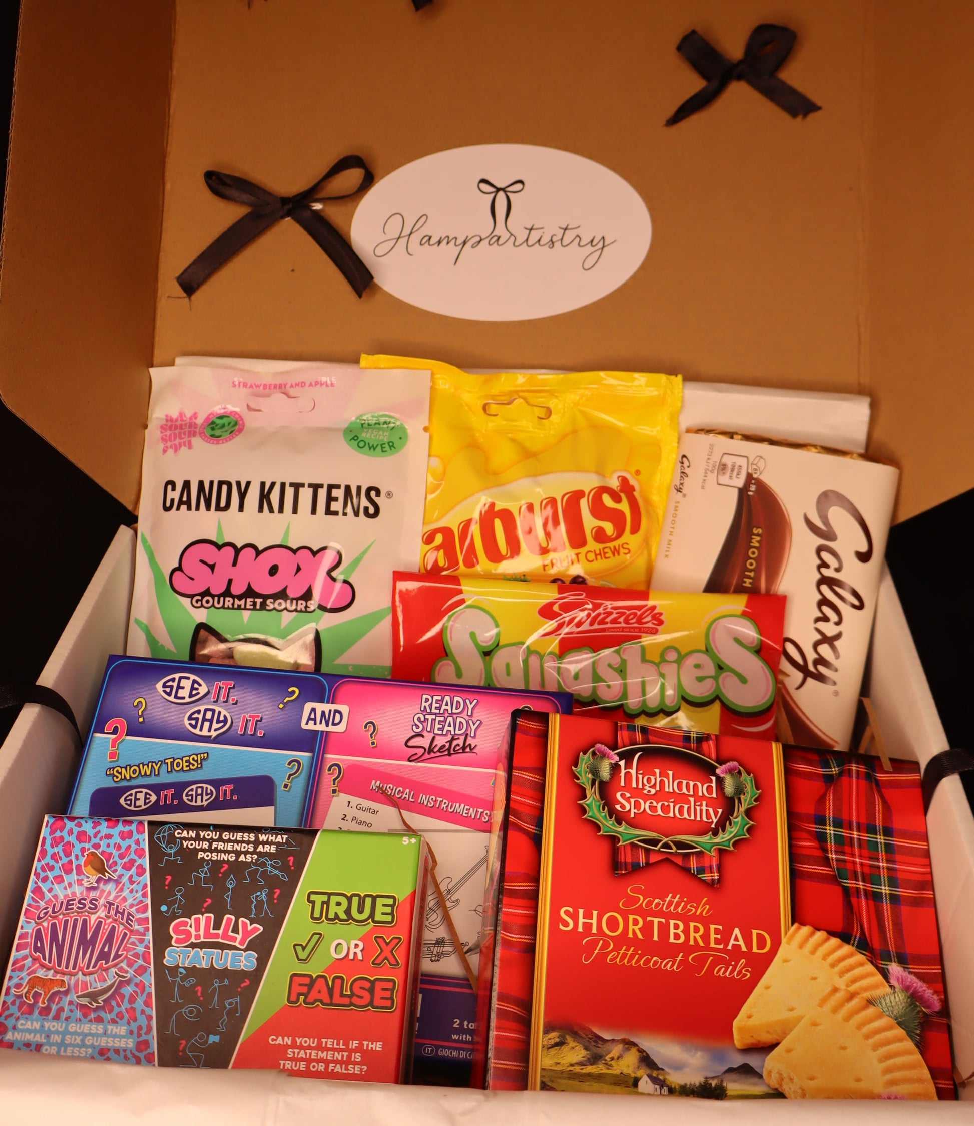 Box of snacks with visible branding and product names