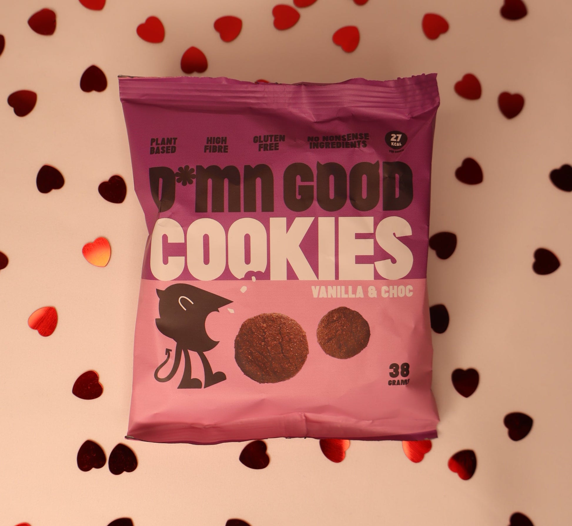 Pink 'Cookies' packaging with heart-shaped confetti on a white background.