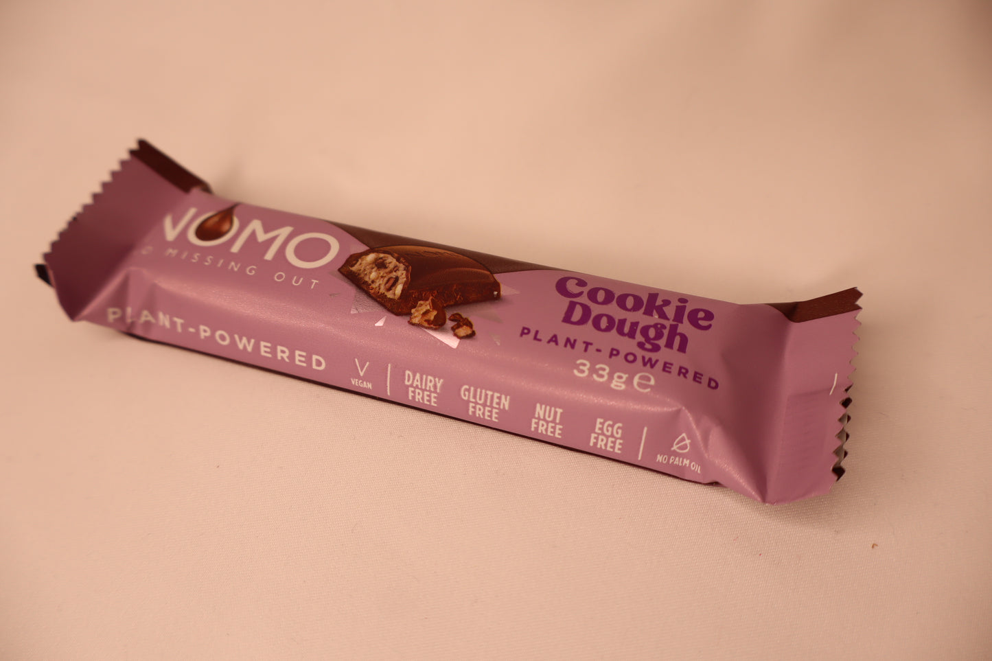 Nomo Cookie Dough Bar in purple packaging